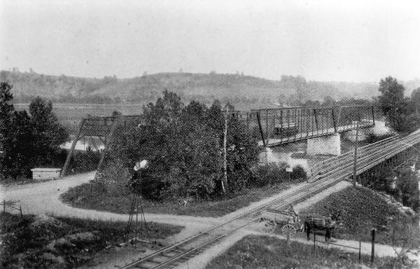 A CL&A car is crossing the Great Miami River on the ca. 1884 highway bridge
