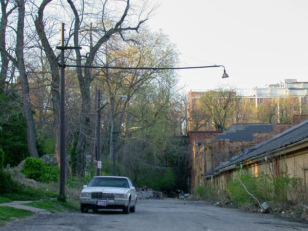 Trolley poles with wire mast arms behind the Avondale division car barn before demolition