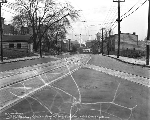 Historic photo of the Cincinnati & Westwood tracks crossing Harrison Avenue in South Fairmount after repaving