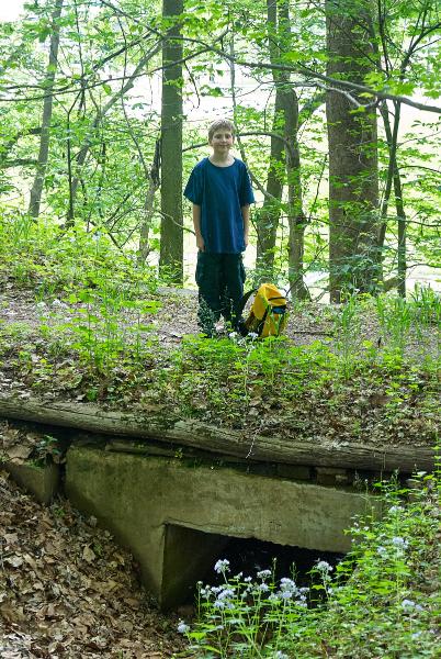 Tyler is posing from atop the culvert from the last two photos