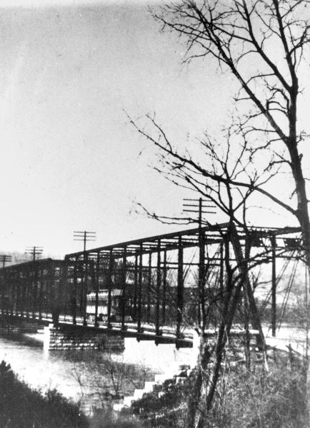 Historic photo of the highway bridge over the Great Miami River with a CL&A car crossing