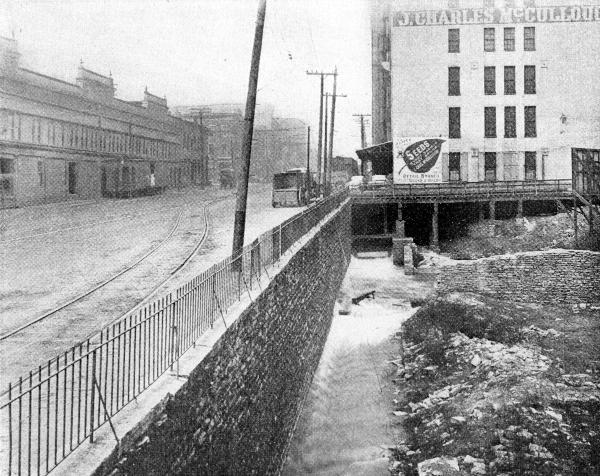 Historic photo of the Miami & Erie Canal mill race next to Eggleston Avenue from the previous photo