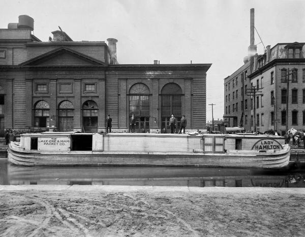 Historic photo of the Lady Hamilton boat of the Lake-Erie & Miami Packet Company at the Plum Street bend of the Miami & Erie Canal