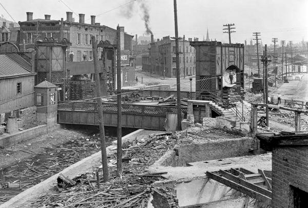 Historic photo of the Mohawk Place lift bridge over the Miami & Erie Canal after draining and preparation for demolition