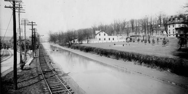 Historic photo of the Miami & Erie Canal along Colerain Avenue near Brashears Street and what is today Cincinnati State College
