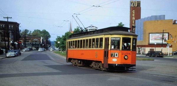 Historic photo of a typical streetcar in the classic "traction orange" and cream paint scheme at Oakley Square
